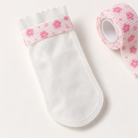 White nonwoven paw cover and pink floral wrap detail