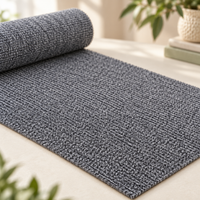 Close-up of the grey scratch protection mat's ribbed woven texture